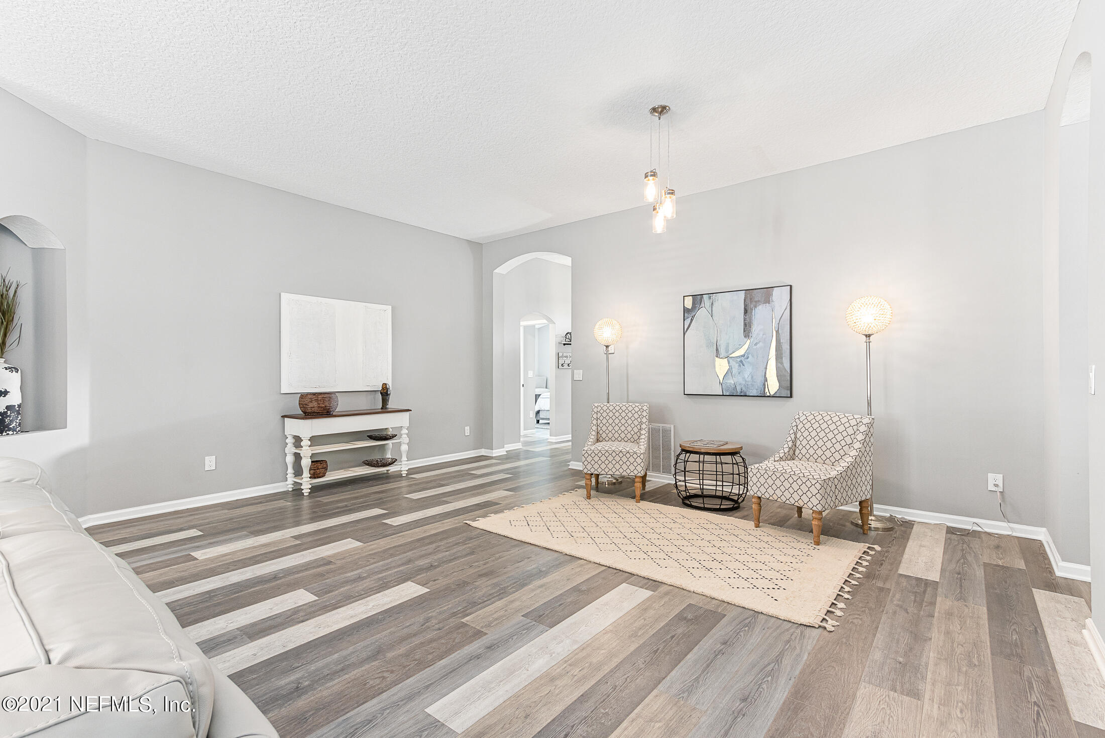856 Crystal Spring Way St. Augustine, FL 32092 - Photo 10 of 54 a bedroom with a bed and a chair