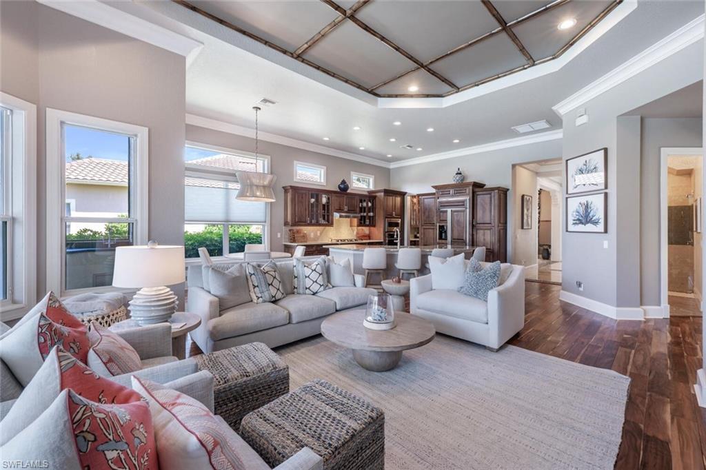 3086 Aviamar Circle Naples, FL 34114 - Photo 21 of 50 a living room with furniture and a large window