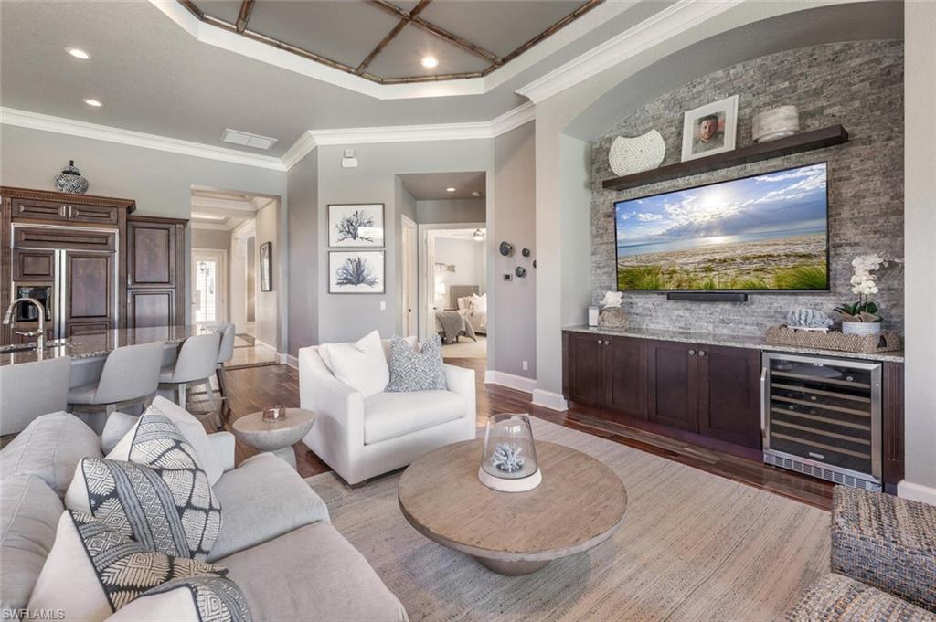 3086 Aviamar Circle Naples, FL 34114 - Photo 22 of 50 a living room with furniture and a flat screen tv