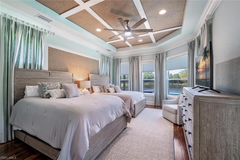 3086 Aviamar Circle Naples, FL 34114 - Photo 23 of 50 a bedroom with double bed and a large window