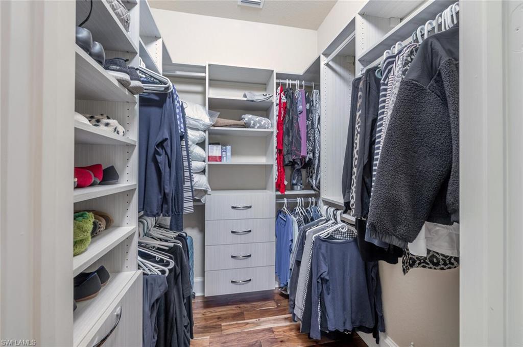 3086 Aviamar Circle Naples, FL 34114 - Photo 27 of 50 a view of walk in closet with clothes