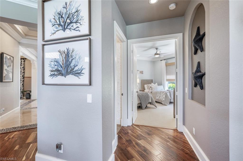 3086 Aviamar Circle Naples, FL 34114 - Photo 28 of 50 a bedroom with a bed and a painting on the wall