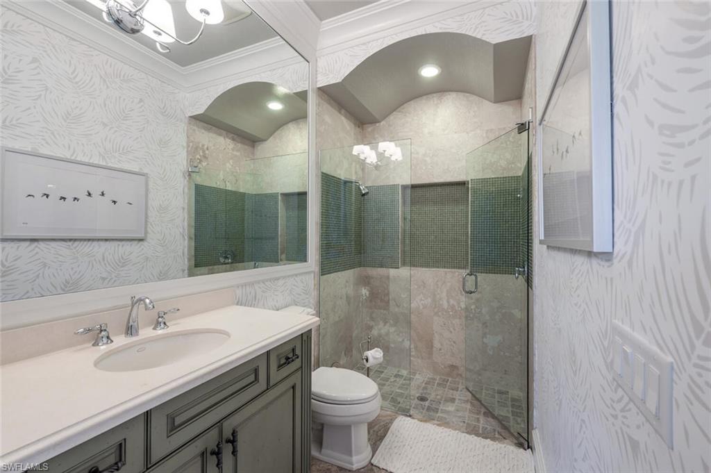 3086 Aviamar Circle Naples, FL 34114 - Photo 30 of 50 a bathroom with a sink toilet and shower
