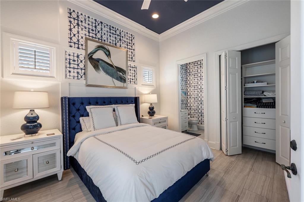 3086 Aviamar Circle Naples, FL 34114 - Photo 33 of 50 a bedroom with a bed and a window