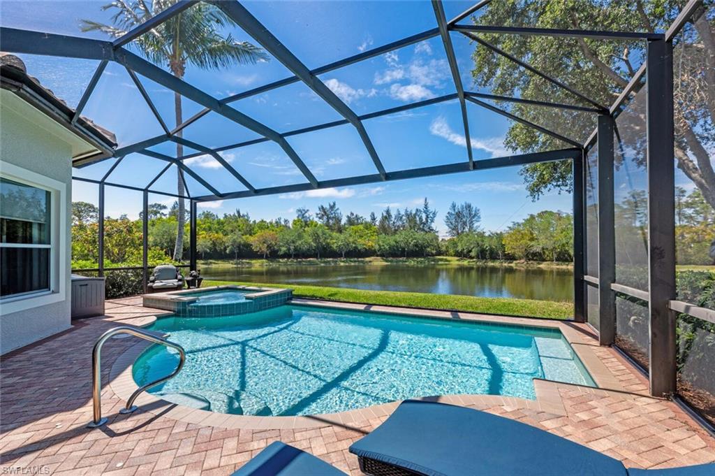 3086 Aviamar Circle Naples, FL 34114 - Photo 40 of 50 a view of a swimming pool with a patio