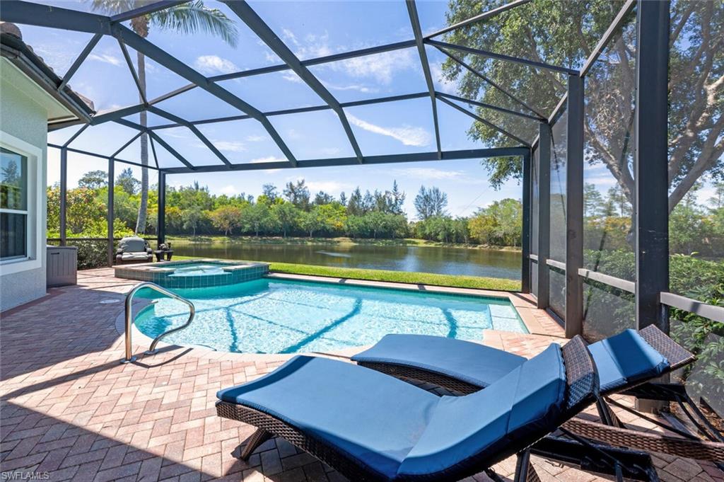 3086 Aviamar Circle Naples, FL 34114 - Photo 43 of 50 a swimming pool with outdoor seating