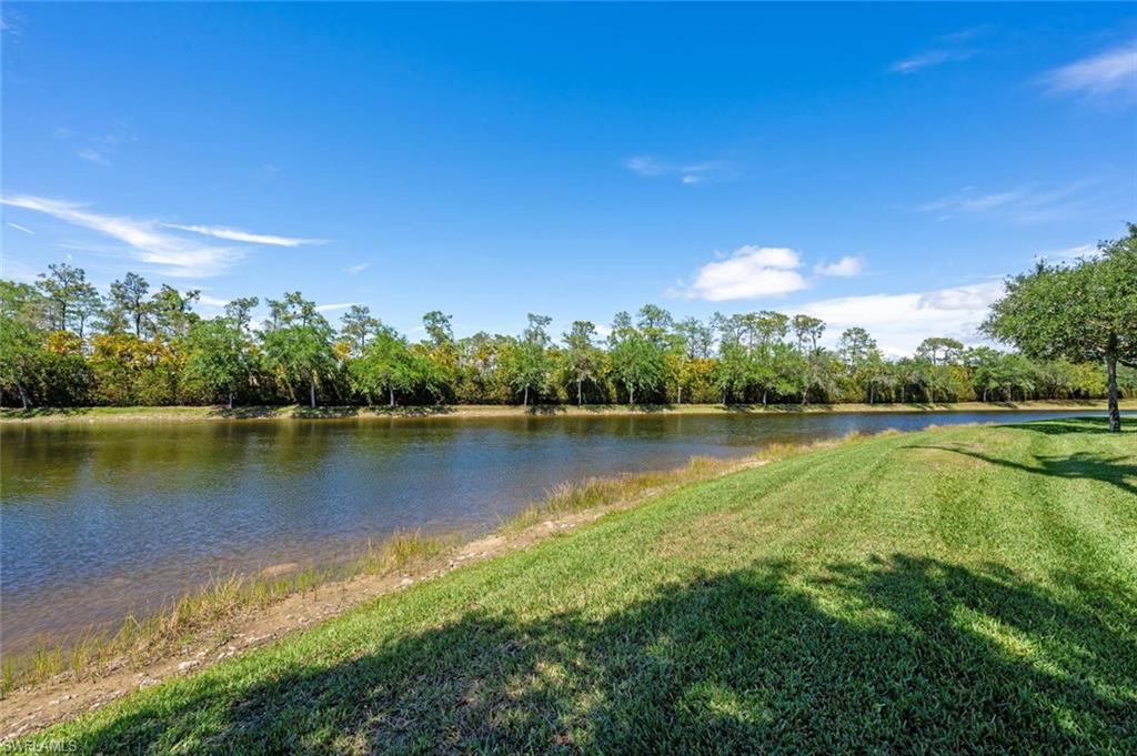 3086 Aviamar Circle Naples, FL 34114 - Photo 49 of 50 a view of a lake with a city view