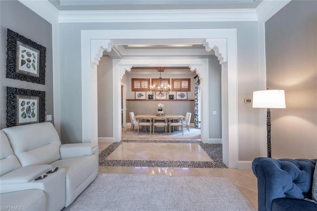 3086 Aviamar Circle Naples, FL 34114 - Photo 6 of 50 a living room with furniture and a fireplace