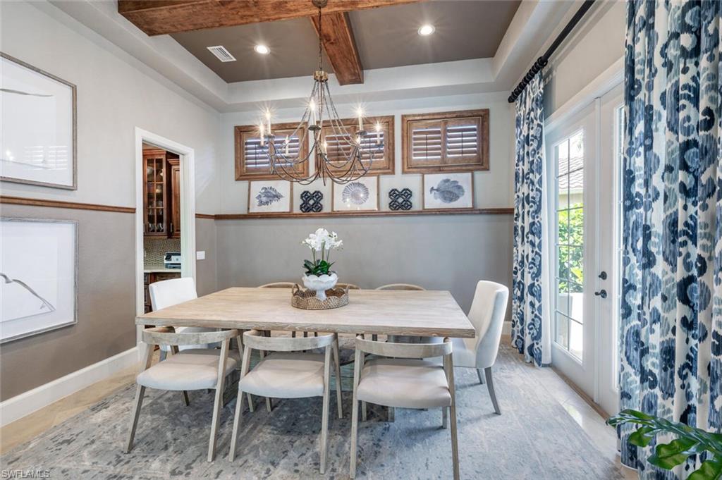 3086 Aviamar Circle Naples, FL 34114 - Photo 7 of 50 a view of a dining room with furniture and window