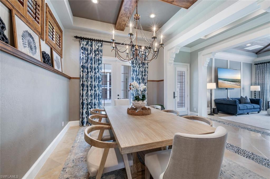 3086 Aviamar Circle Naples, FL 34114 - Photo 8 of 50 a view of a dining room with furniture and wooden floor