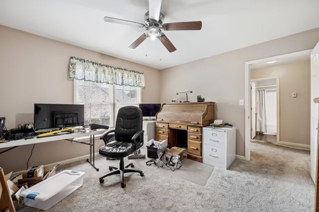 a living room with furniture a wooden floor and a fireplace