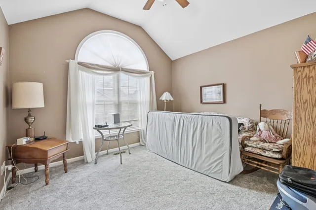 a living room with furniture a wooden floor and a fireplace