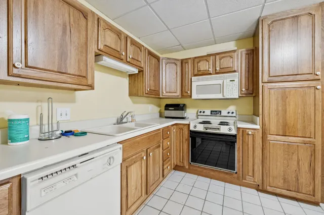 a living room with furniture gym equipment and a fireplace