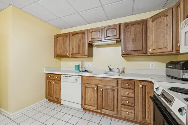 a living room with furniture gym equipment and a fireplace