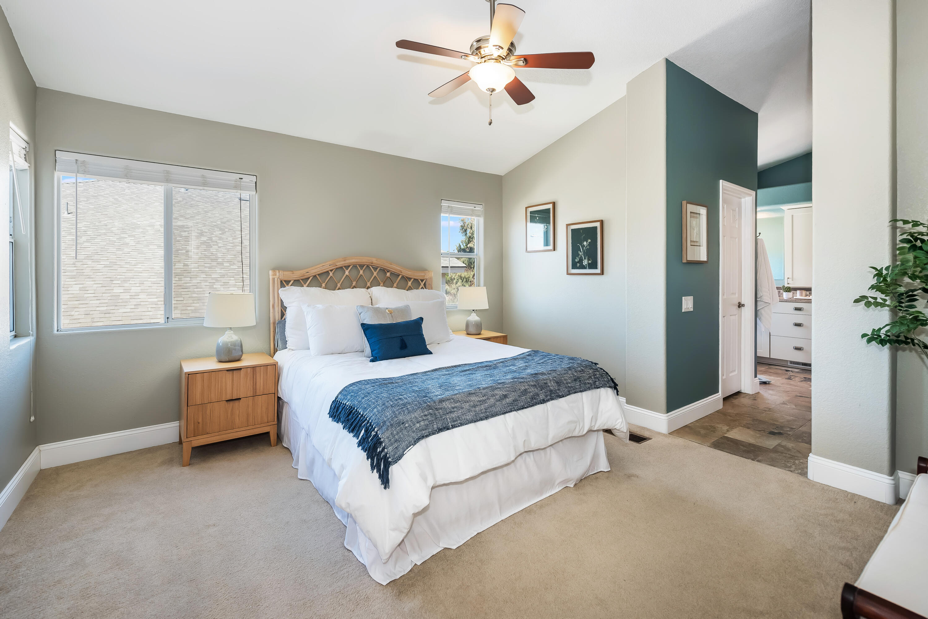 1328 Glen Ellen Lane Lompoc, CA 93436 - Photo 13 of 30 a spacious bedroom with a bed and a chandelier