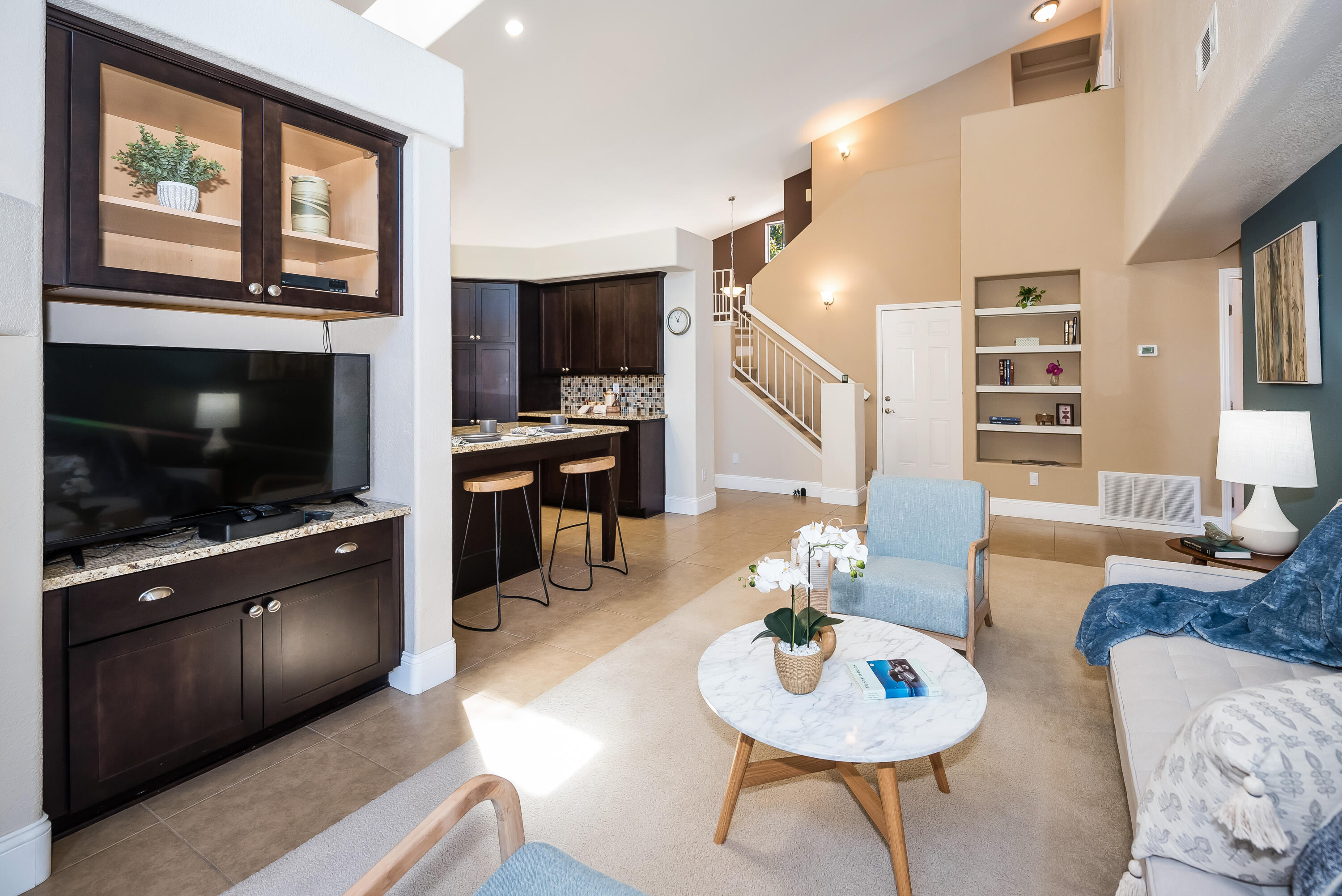 1328 Glen Ellen Lane Lompoc, CA 93436 - Photo 8 of 30 a living room with furniture a flat screen tv and kitchen view