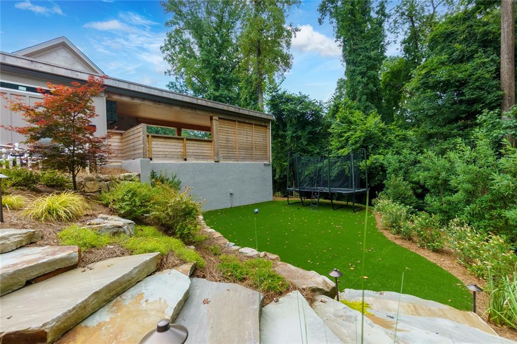 91 Park Circle Northeast Atlanta, GA 30305 - Photo 12 of 80 a view of backyard with potted plants and floor to ceiling window