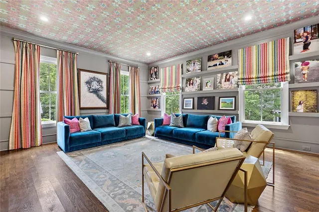 a view of a dining room with furniture and wooden floor