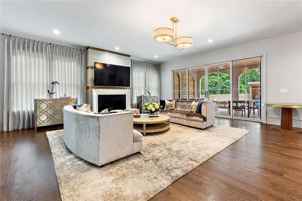 a kitchen with stainless steel appliances a sink stove and cabinets