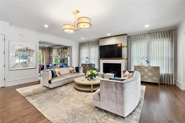 a kitchen with a sink a stove and chairs