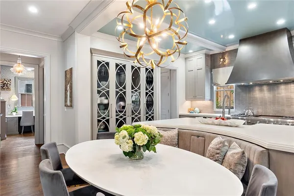 a bedroom with a bed a mirror and a window