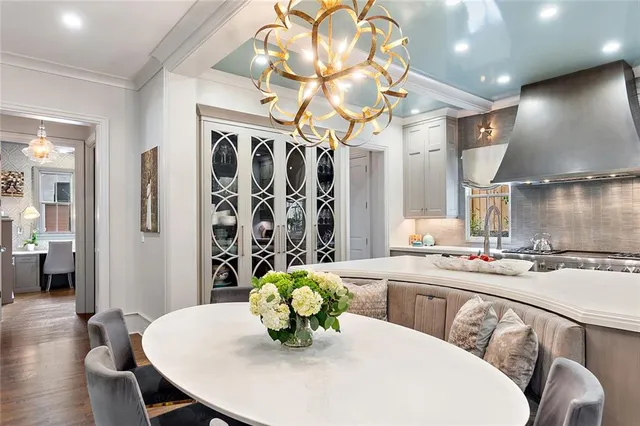 a bedroom with a bed a mirror and a window