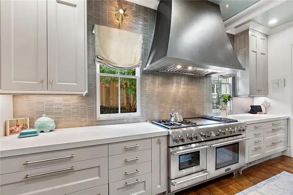 a bedroom with two beds and a large window