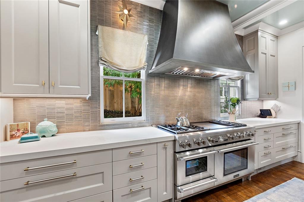 91 Park Circle Northeast Atlanta, GA 30305 - Photo 34 of 80 a kitchen with stainless steel appliances granite countertop a stove and a sink