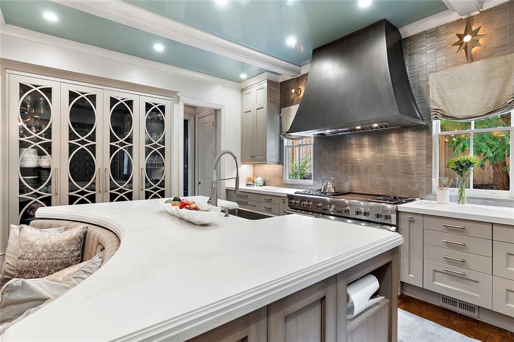 91 Park Circle Northeast Atlanta, GA 30305 - Photo 35 of 80 a kitchen with a sink a stove and chairs