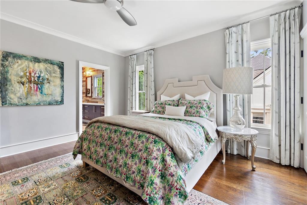 91 Park Circle Northeast Atlanta, GA 30305 - Photo 43 of 80 a bedroom with a bed a mirror and a window