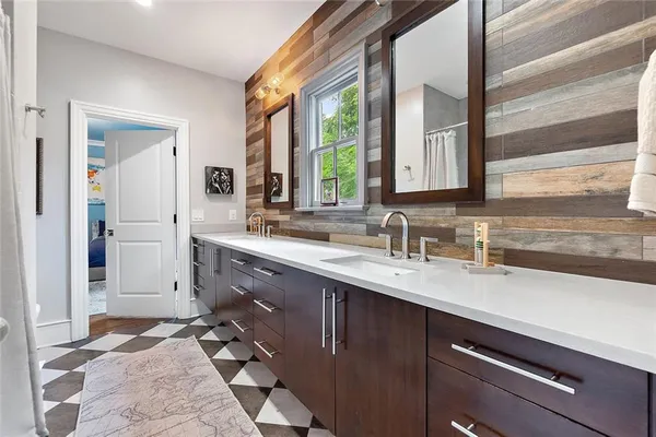 a view of a dining room with furniture and a window
