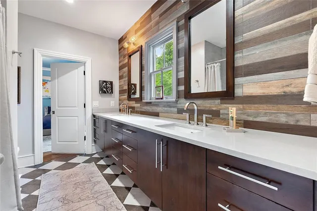 a view of a dining room with furniture and a window