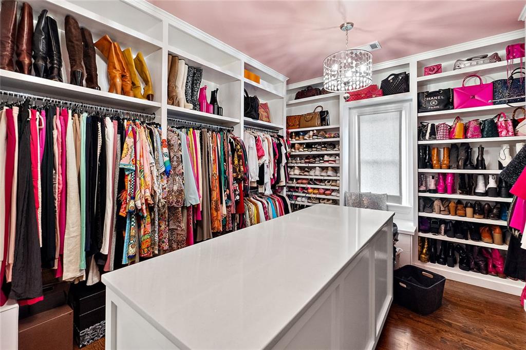 91 Park Circle Northeast Atlanta, GA 30305 - Photo 49 of 80 a view of walk in closet with clothes and shoes