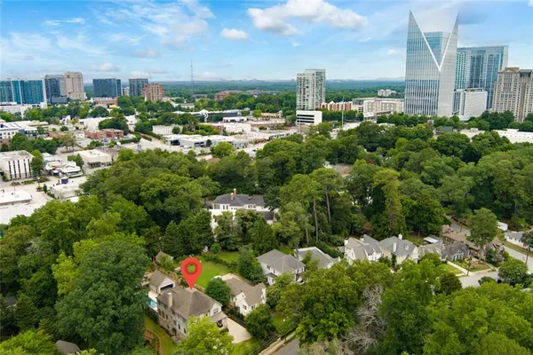 an aerial view of a house with a yard