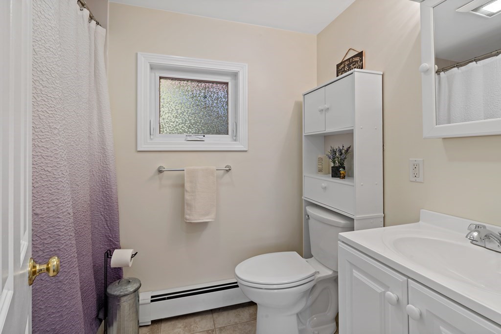 55 Alpine Road Weymouth, MA 02189 - Photo 11 of 31 a bathroom with a toilet sink and mirror