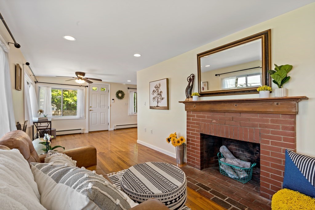 55 Alpine Road Weymouth, MA 02189 - Photo 18 of 31 a living room with furniture and a fireplace