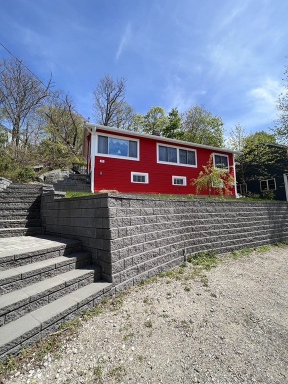 55 Alpine Road Weymouth, MA 02189 - Photo 2 of 31 a view of a wooden house with a yard