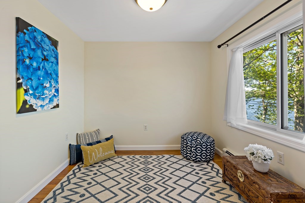 55 Alpine Road Weymouth, MA 02189 - Photo 29 of 31 a bedroom with a bed and wooden floor