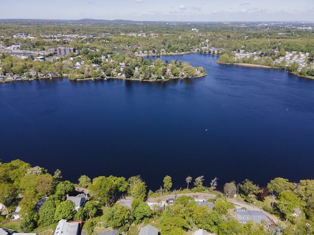 55 Alpine Road Weymouth, MA 02189 - Photo 4 of 31 a view of a lake with a mountain