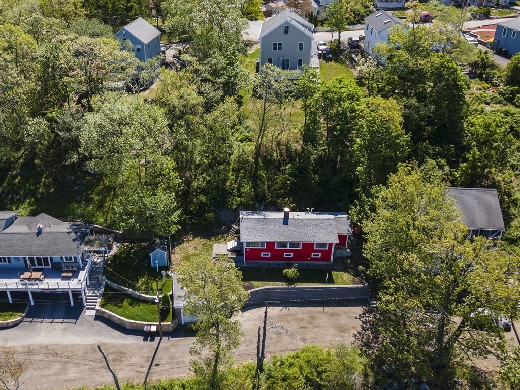 55 Alpine Road Weymouth, MA 02189 - Photo 8 of 31 a sign that is sitting in front of flowers