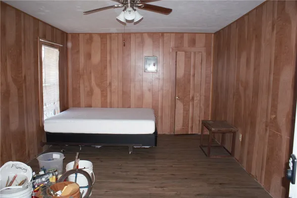 a room with a bed and a chandelier