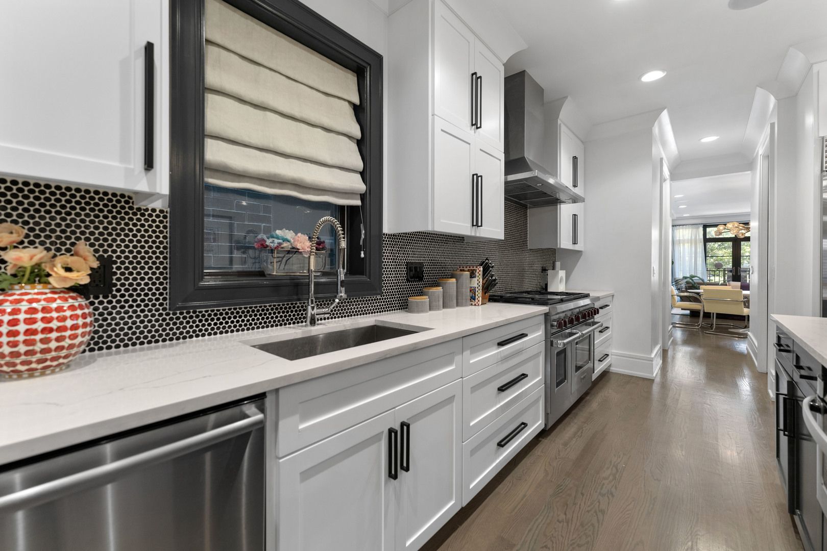2040 North Burling Street, Unit 1 Chicago, IL 60614 - Photo 12 of 29 a kitchen with stainless steel appliances sinks a stove and a refrigerator