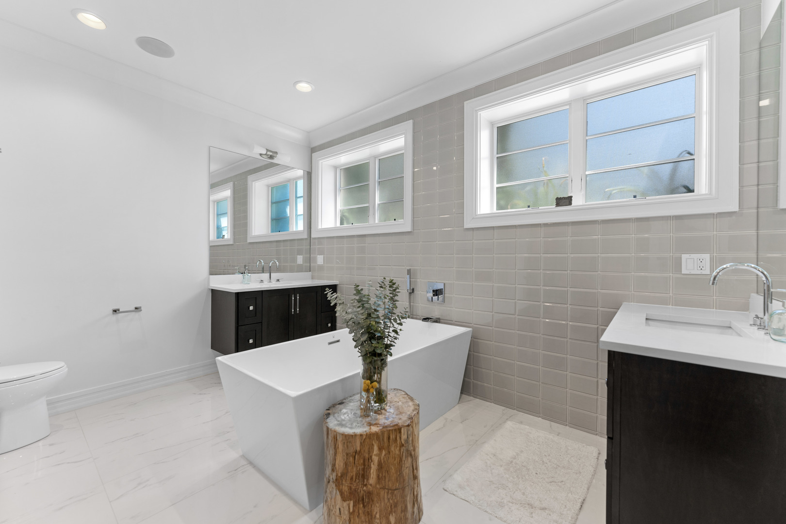 2040 North Burling Street, Unit 1 Chicago, IL 60614 - Photo 19 of 29 a living room with a sink and a mirror