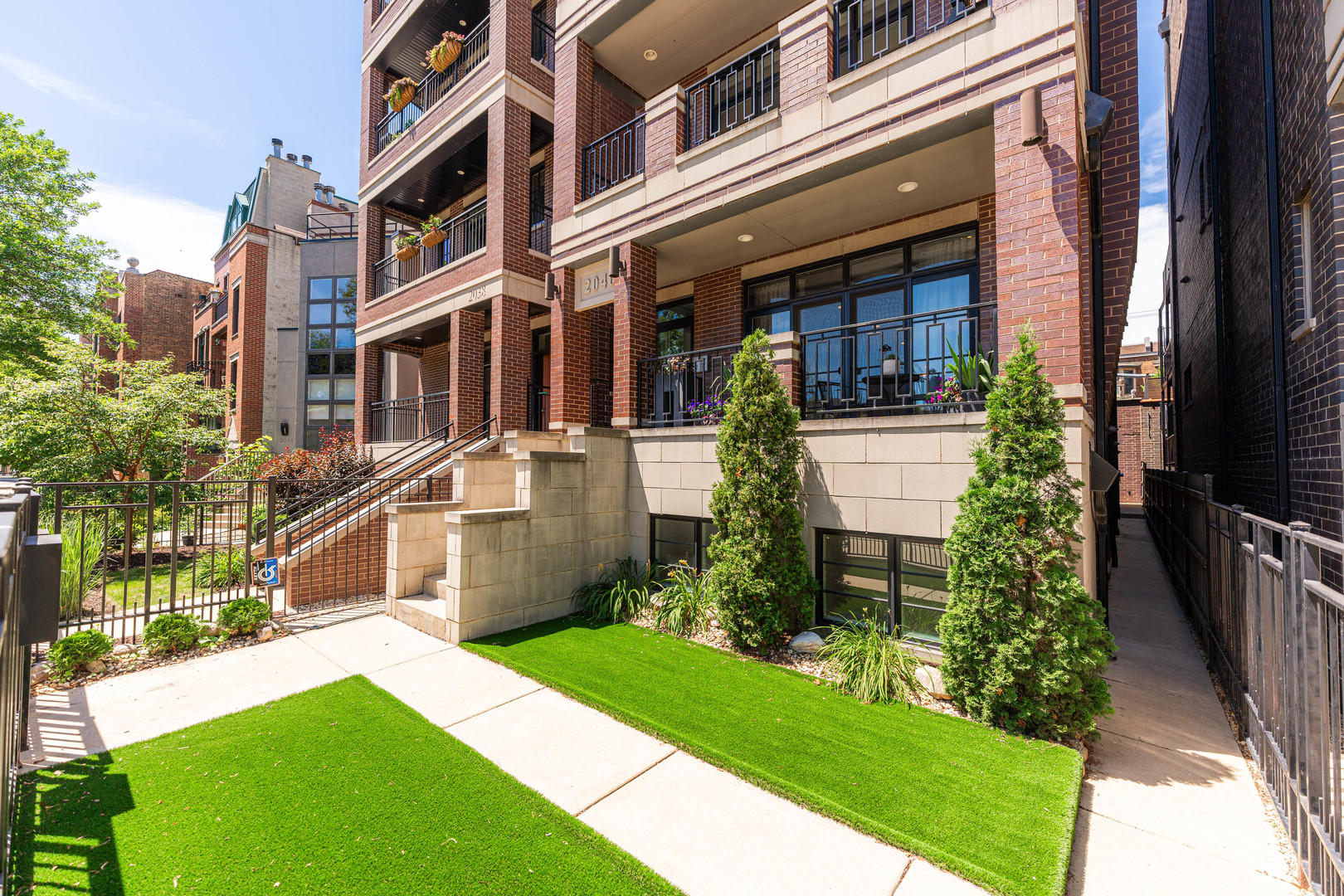 2040 North Burling Street, Unit 1 Chicago, IL 60614 - Photo 2 of 29 a front view of a house with a yard