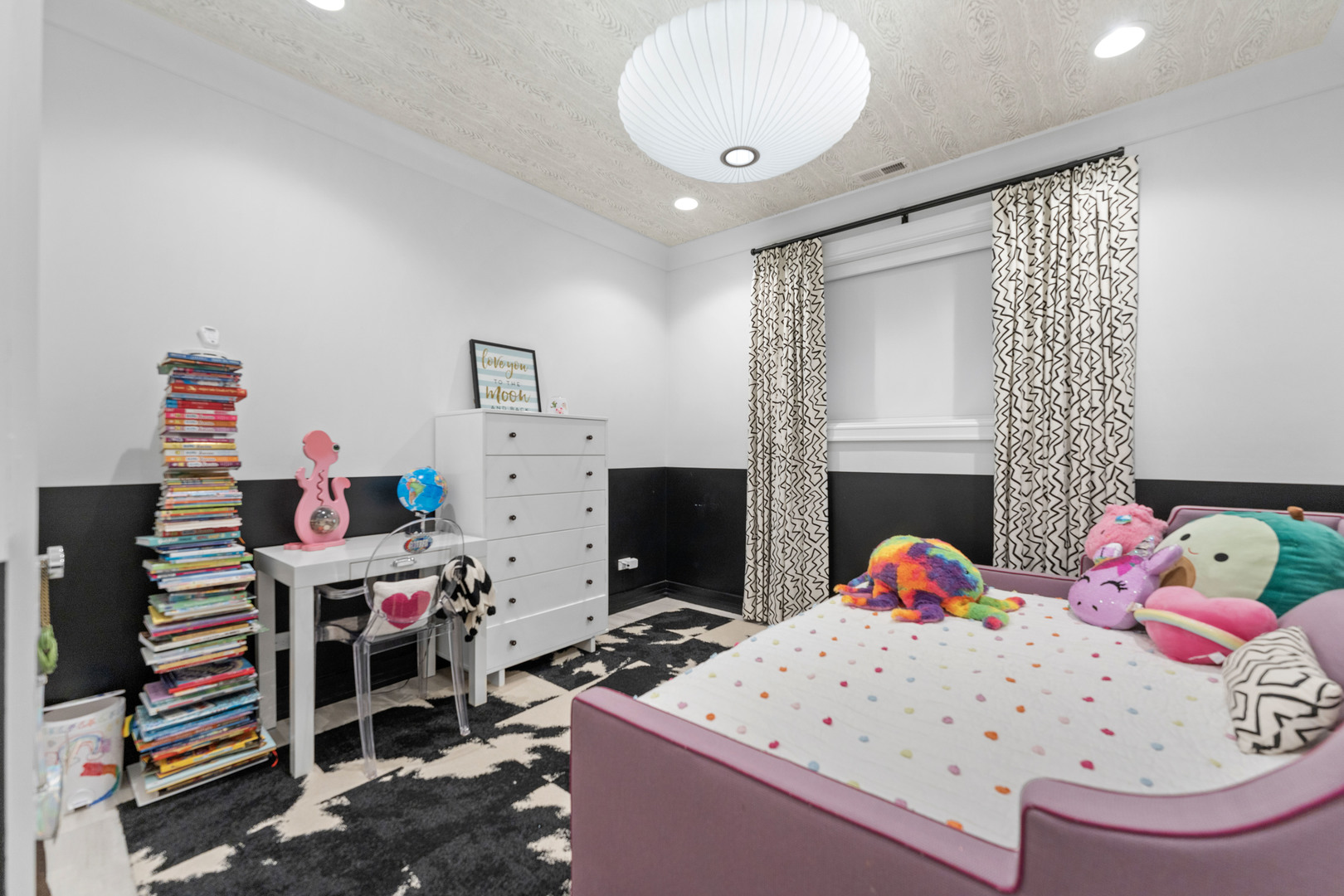 2040 North Burling Street, Unit 1 Chicago, IL 60614 - Photo 23 of 29 a bedroom with furniture and a fireplace