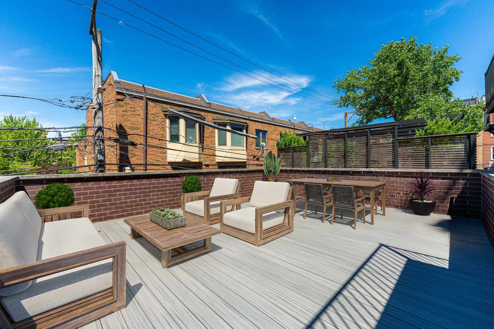 2040 North Burling Street, Unit 1 Chicago, IL 60614 - Photo 25 of 29 a view of a patio with couches table and chairs with wooden floor and fence