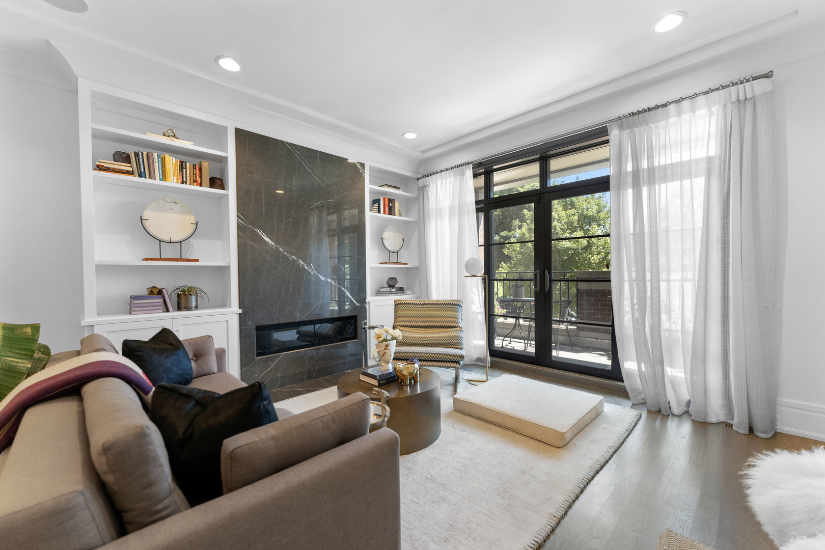 2040 North Burling Street, Unit 1 Chicago, IL 60614 - Photo 4 of 29 a living room with furniture and a floor to ceiling window