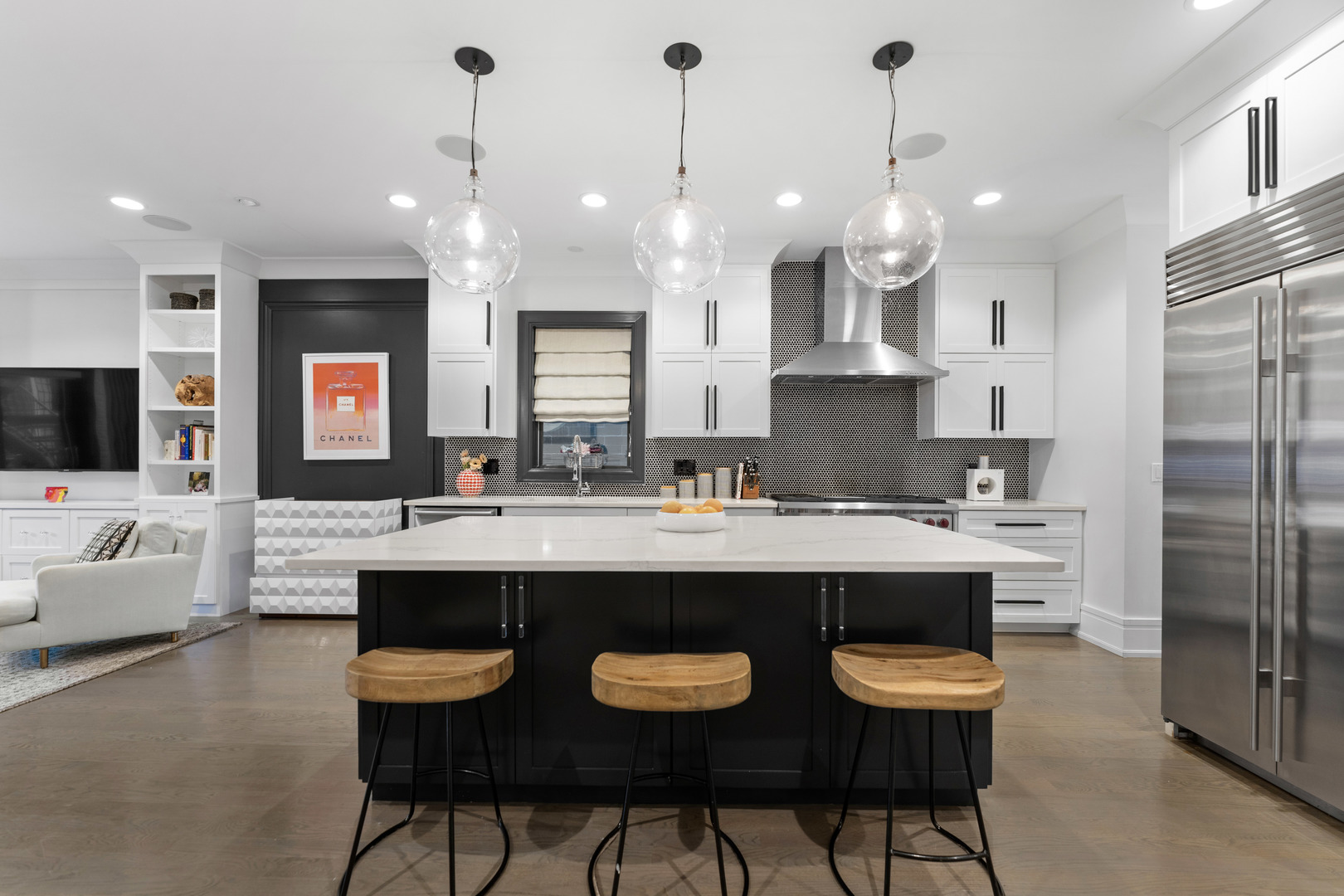 2040 North Burling Street, Unit 1 Chicago, IL 60614 - Photo 10 of 29 a view of a kitchen with kitchen island stainless steel appliances a stove a sink a oven a dining table and chairs