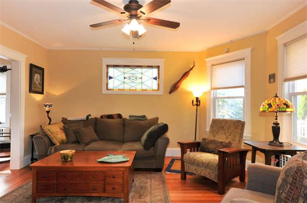 17 Garth Road Boston, MA 02132 - Photo 3 of 25 a living room with furniture and a window
