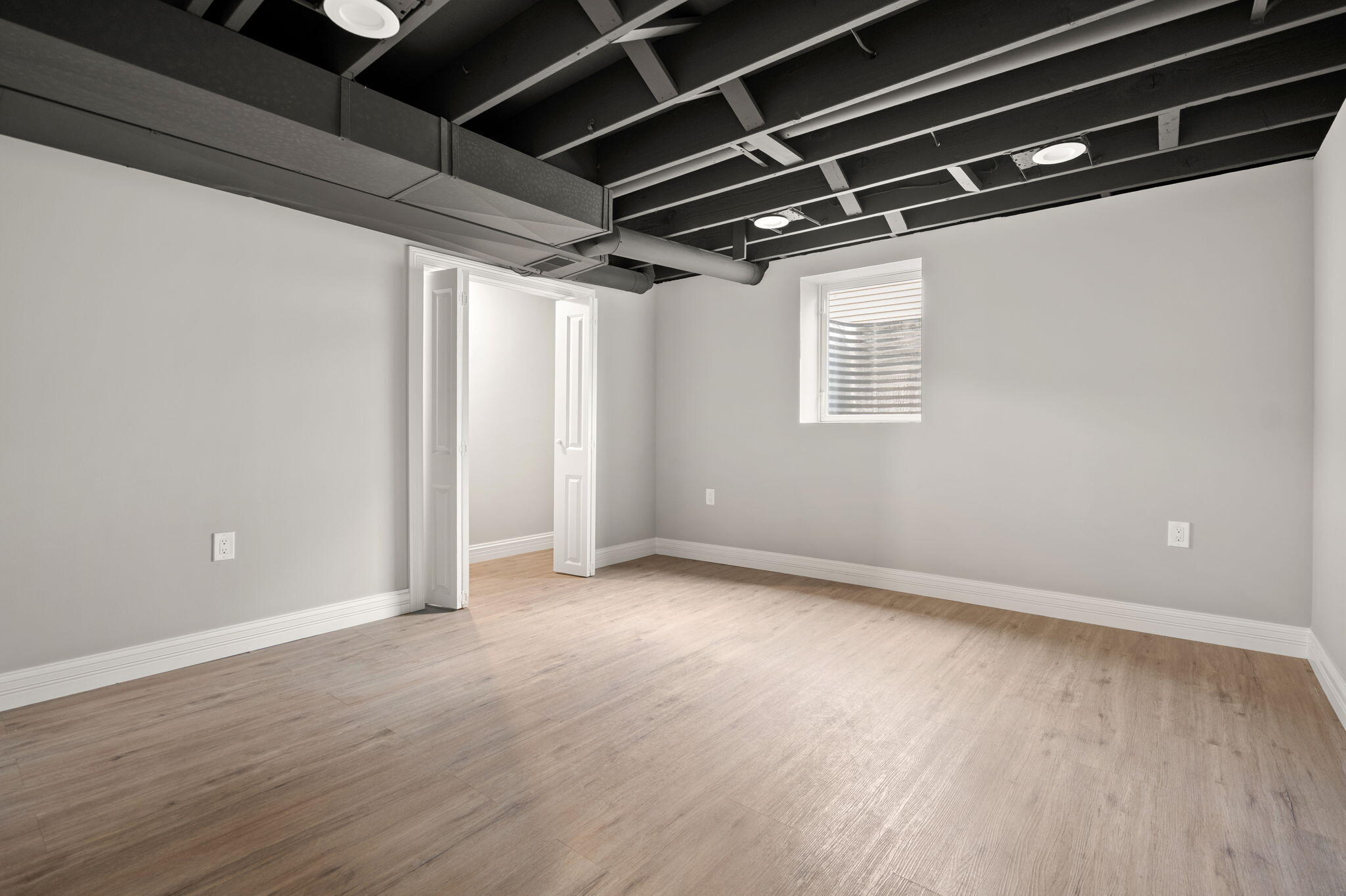 8749 Monroe Avenue Munster, IN 46321 - Photo 27 of 33 a view of an empty room with wooden floor and windows